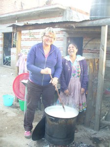 Stirring the atole with Bertha